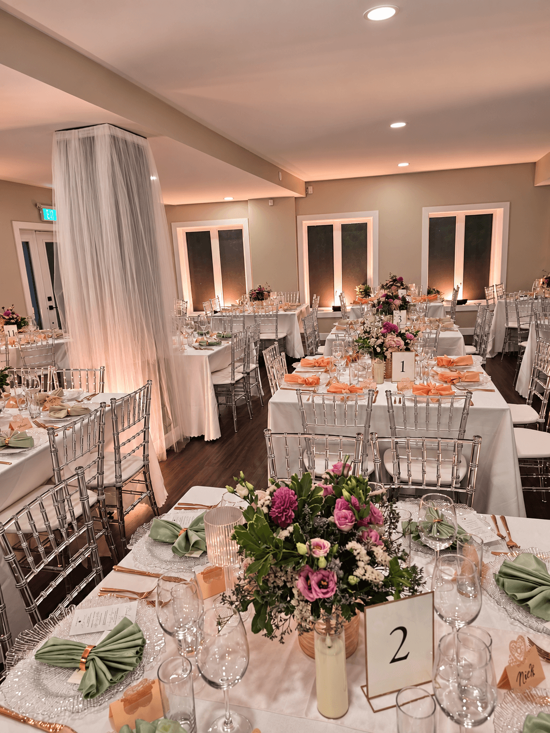 An elegant wedding reception set with flowers and candlelight