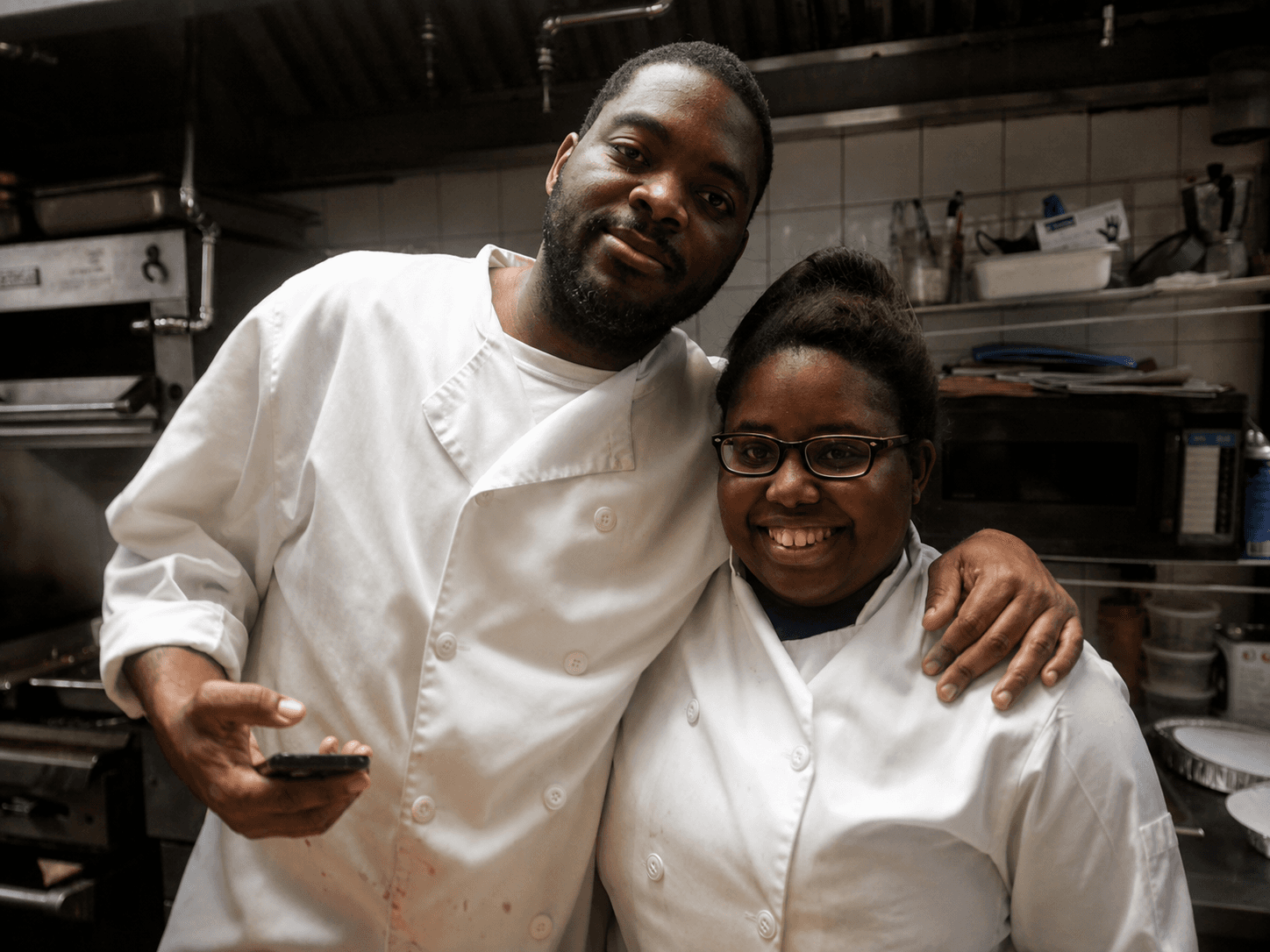 Chef Sean with his daughter Shai in a restaurant kitchen
